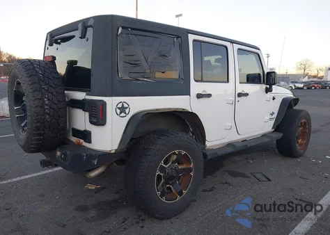 2013 Jeep Wrangler Unlimited Freedom Edition из США, поврежденный, VIN 1C4HJWDG2DL569561